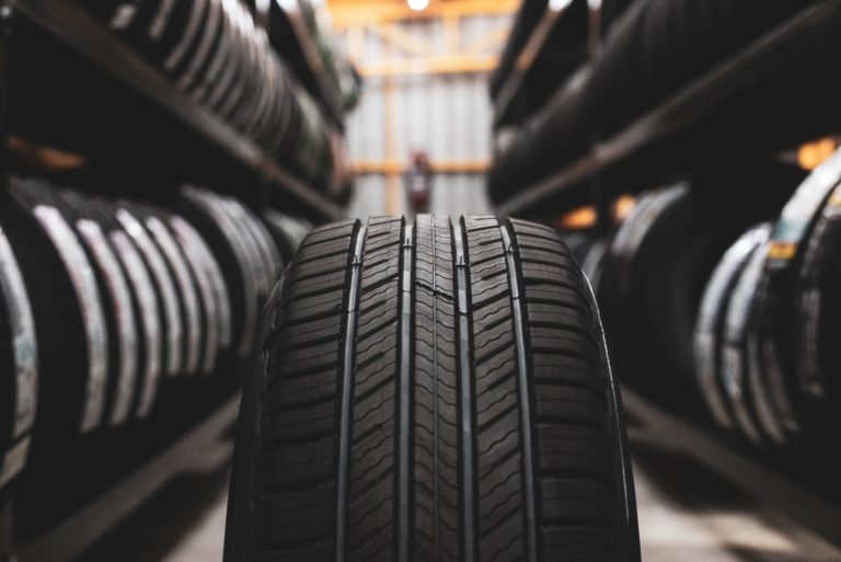 Range of car tyres photographed in a garage
