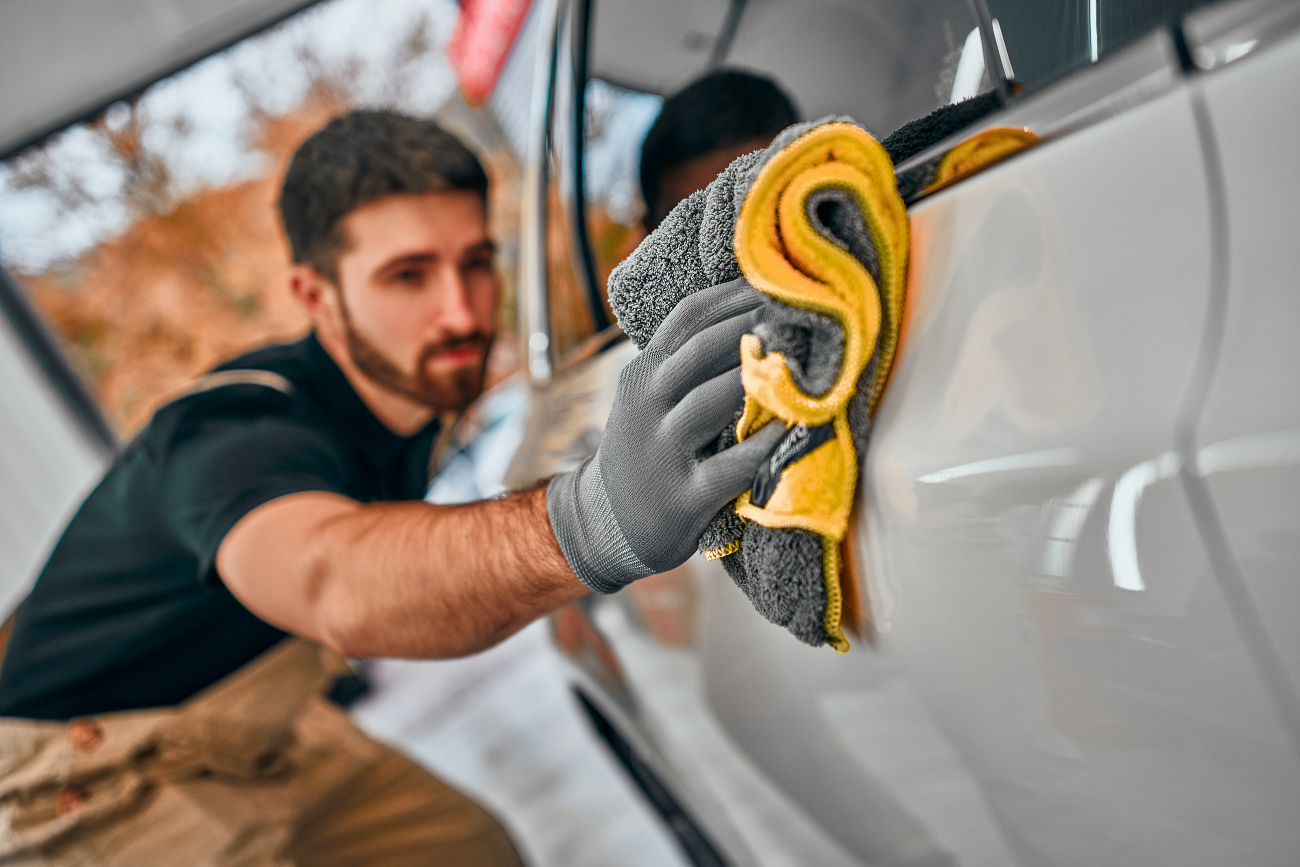 cleaning car with a cloth