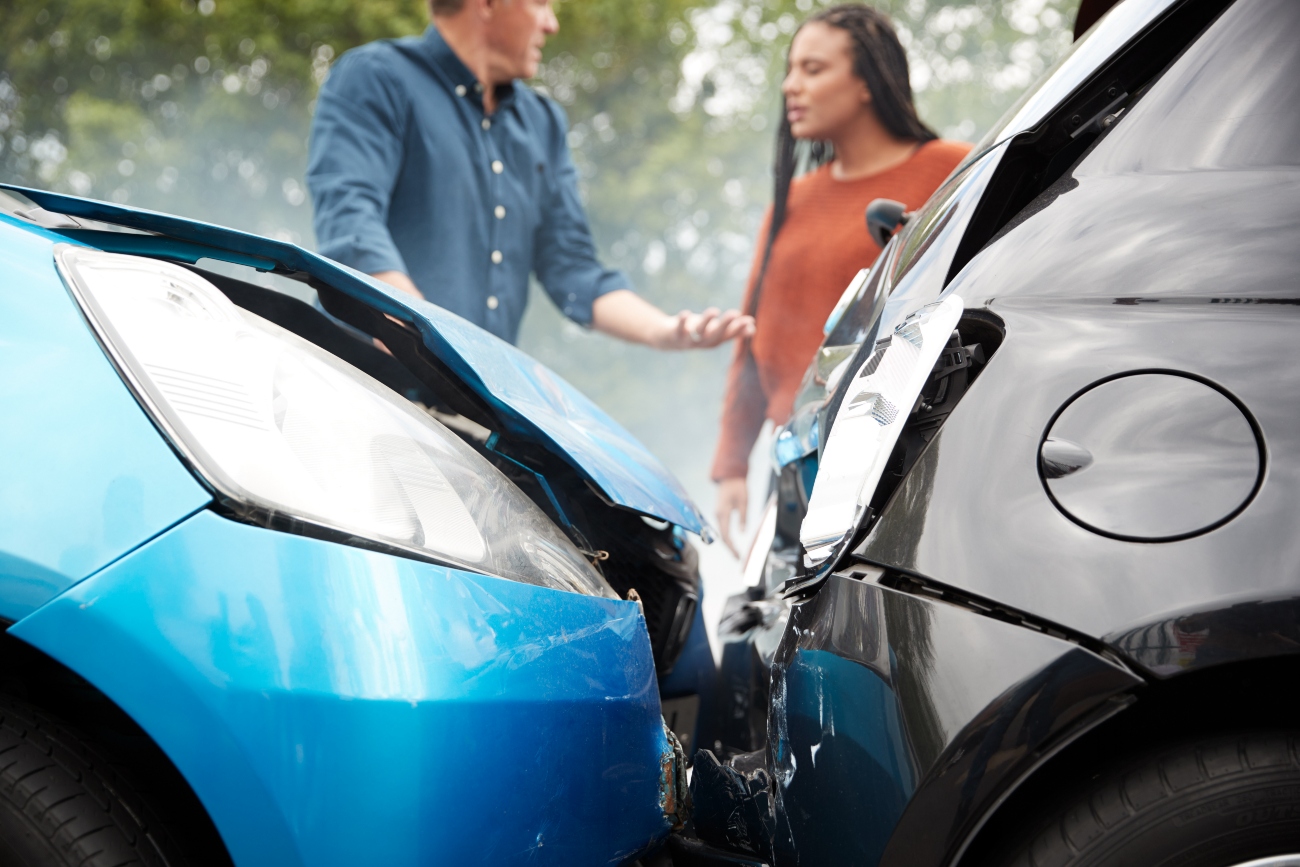 two people talking after a car accident